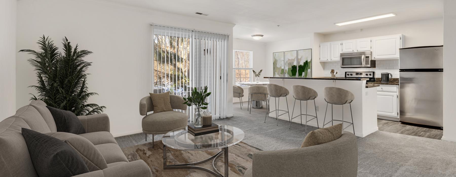 a living room with a couch and chairs