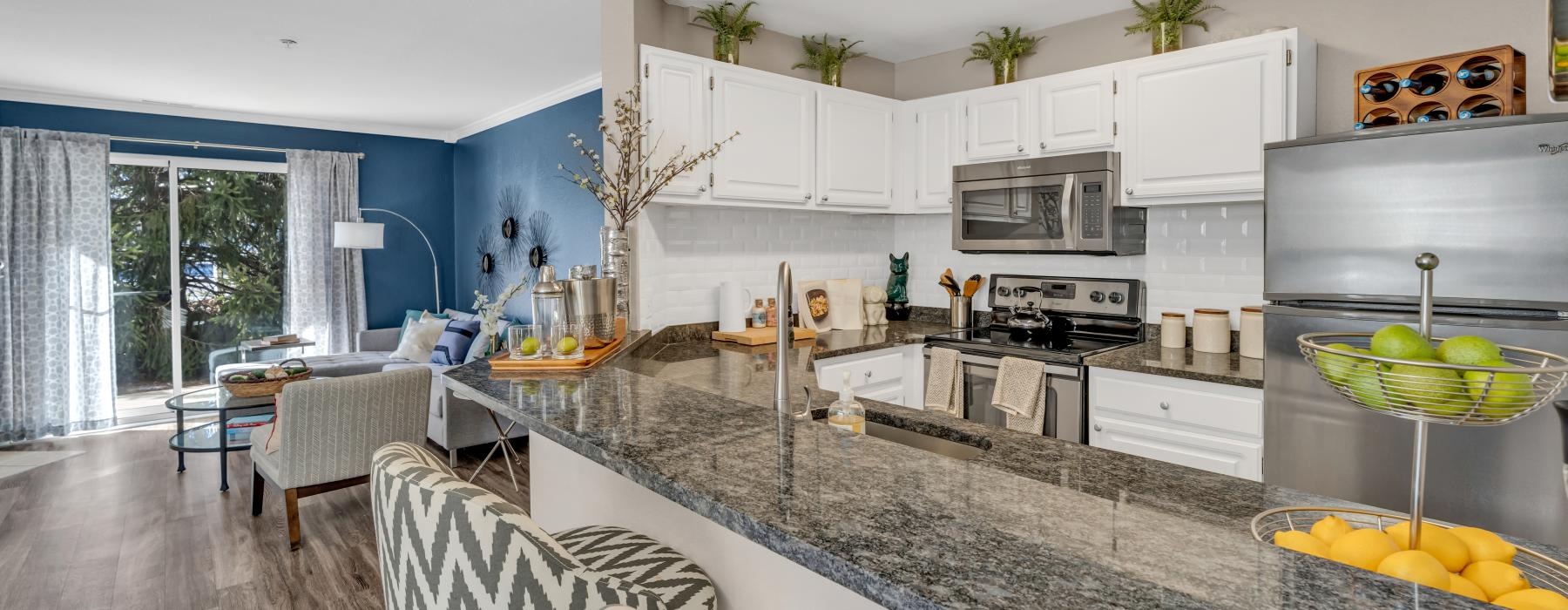 a kitchen with a marble island