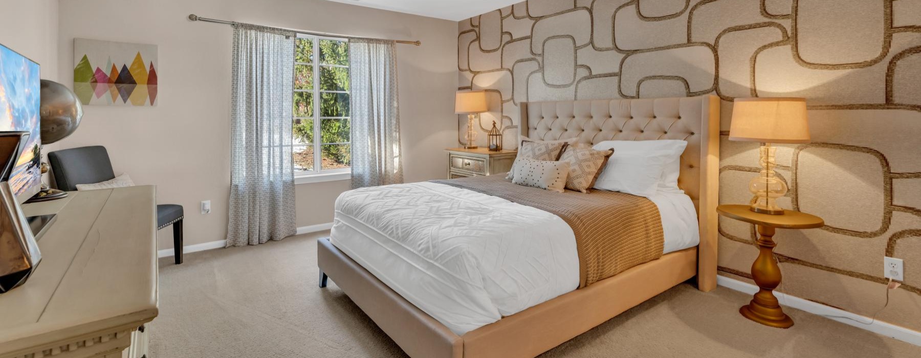 a bedroom with a bed and a dresser