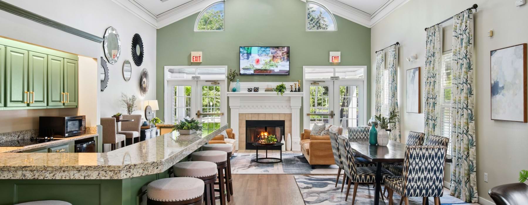 a clubhouse room with tables and chairs