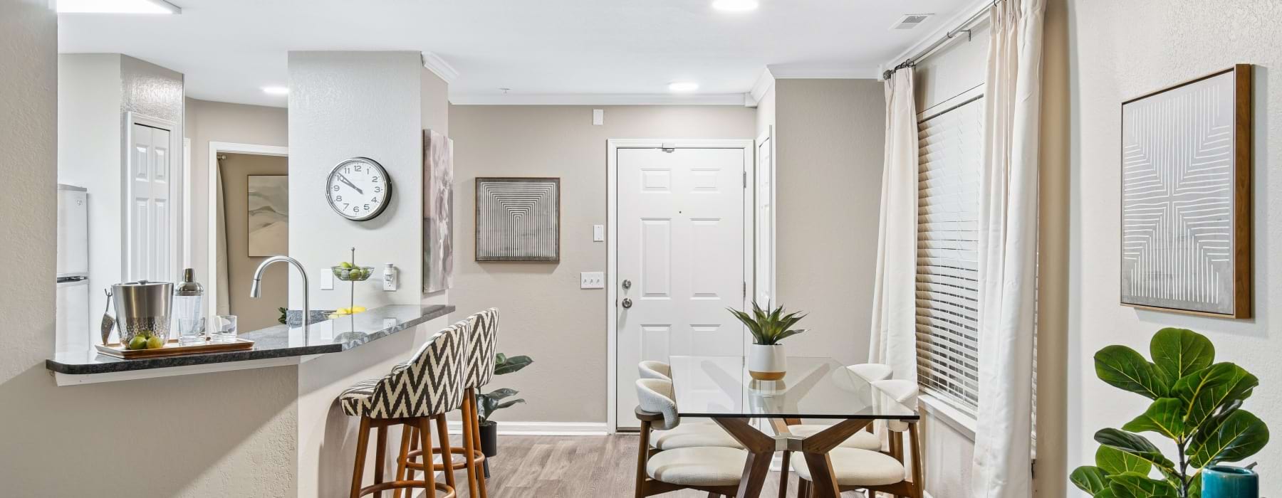 a living room with a couch and chairs